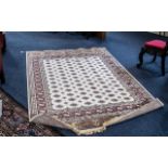 A Genuine Cashmere Rug, in as new condition, With cream ground, Measures 90 by 60 inches.