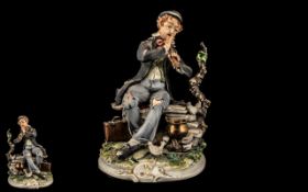 Capodimonte Limited Edition by Meneghetti, depicting a tramp playing a flute with doves.