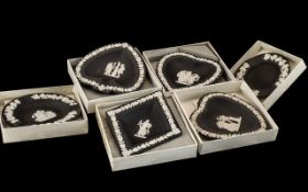 Collection of Wedgwood Black Jasper comprising four assorted sweet dishes, and two ashtrays.