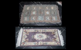 Two Small Rugs, one beige wool with cream floral relief and fringing, measuring 24'' x 56''