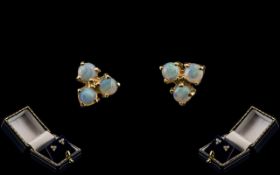 9ct Gold Opal Earrings, gold earrings set with three opals to each,