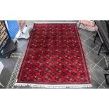 A Genuine Excellent Quality Persian Turkmen Carpet/Rug decorated in a Bukhari design on red