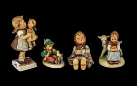 Four Hummel Goebel Figures of Children, showing a singing lesson, feeding birds,