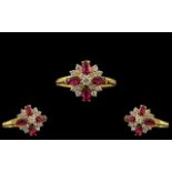 18ct Gold - Ladies Attractive Diamond and Ruby Set Ring In a Flower head Setting.