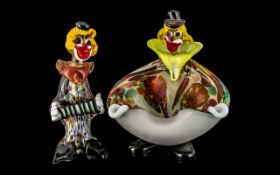 Two Murano Clowns, one in the form of a bowl, the other playing a squeeze box.