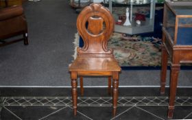Victorian Mahogany Hall Chair with a Shaped Shield Back on Turned Legs.