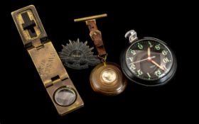 Military Smiths Magnetic Clock with a Black Dial, WIth an Australian Military Force Cap Badge,