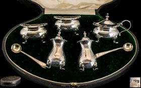 A Five Piece Mappin and Webb Silver Cruet Set to include two peppers, two salts and a mustard pot.