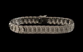 A 9ct Gold Diamond Bracelet set with round cut diamonds in a milligrain setting.