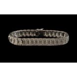A 9ct Gold Diamond Bracelet set with round cut diamonds in a milligrain setting.
