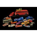 A Collection of Dinky Cars to include K-304 Aircraft Carrier, a red petrol truck, a red school bus,