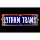 An Antique Enamel on Tin Lytham Trams Sign rough edges all around. Screwed to a modern back board.