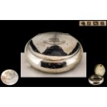 A Silver Squeeze Tobacco Box of typical oval/round form. Hallmarked for Birmingham H 1907.