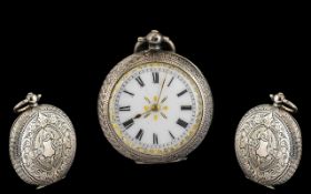 French Silver Fob Watch with a White Enamel Dial with Gilt Edge Border In a Double Engraved Case.