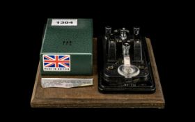 A Military Morse Code Tapper Model No. 1321000, Serial No. 8905920. Made in Britain. 7" Square.