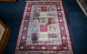 A Genuine Cashmere Red Ground Carpet/Rug. Persian panel design. As new condition. Measures 2.40 by