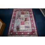 A Genuine Cashmere Red Ground Carpet/Rug. Persian panel design. As new condition. Measures 2.40 by