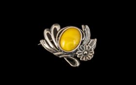 Silver and Amber Art Nouveau Style Brooch with cabochon cut egg yolk amber centre stone,