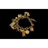 9ct Gold Vintage Charm Bracelet - Loaded with 16 9ct Gold Charms.