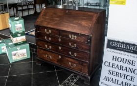 A Walnut George III Bureau with full fro