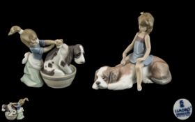 Lladro Pair of Hand Painted Porcelain Figures - Girls Washing Their Pet Dogs.