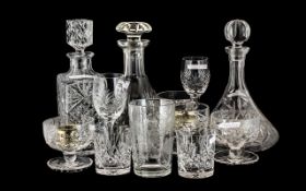 Three Various Cut Glass Decanters with stoppers, cut glass sundae dishes,