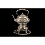 Victorian Embossed Metal Spirit Kettle, raised on a stand.