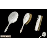 Ladies Silver Three Piece Vanity Set comprising a hand mirror, hair brush and clothes brush,