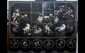 A Six Panel Chinese Lacquered and Hardstone Applied Screen depicting wild horses in landscape with