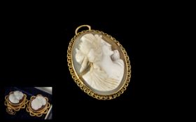 Cameo Pendant with delicate gold fretwork edging, marked 9 ct.