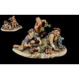 Large Capodimonte Porcelain Figure by Rori of Tramp Sleeping, with two children. 14.5'' wide.