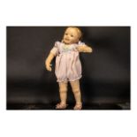 Lifelike Ashton Drake Doll measuring 21" (70 cm). Fully clotherd and marked WH & ADG D5.