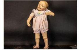 Lifelike Ashton Drake Doll measuring 21" (70 cm). Fully clotherd and marked WH & ADG D5.