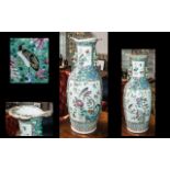 A Chinese 19th Century Cantonese Vase decorated in Famille Rose enamels,