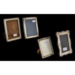 Four Photograph Frames comprising two small silver frames, 7 inches (17.5cms) x 5 inches ( 12.