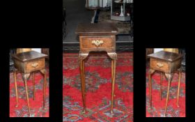 A Queen Anne Style Small Walnut Telephone Table with a centre drawer of Queen Anne shaped legs.
