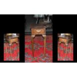 A Queen Anne Style Small Walnut Telephone Table with a centre drawer of Queen Anne shaped legs.