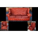 Four Piece Oxblood Button Backed Leather Chesterfield Suite, consisting of: a three seater winged