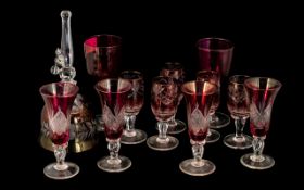 Collection of Ruby Coloured Glass, comprising a bell, four sherry glasses, five liqueur glasses,