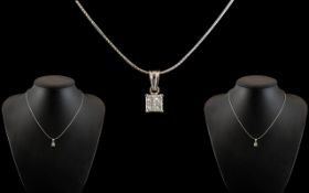 18ct White Gold Diamond Set Pendant, set with four princess cut diamonds, suspended on an 18ct white