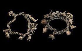 A Pair of Good Quality Vintage Sterling Silver Charm Bracelets - Loaded with 17 Sterling Silver
