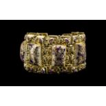 Art Deco Style Bracelet decorated with purple and gold painted pearlised stones,