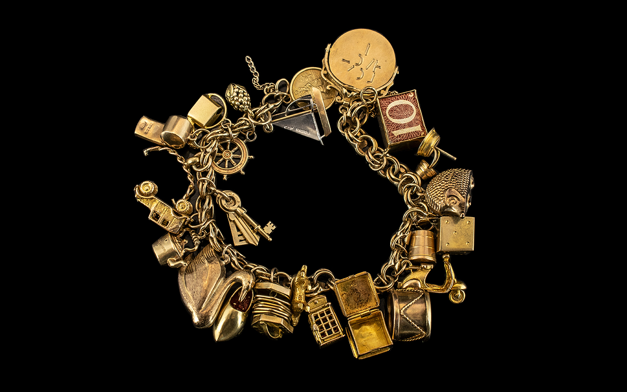 Ladies - Excellent 9ct Gold Charm Bracelet Loaded with 25 9ct Gold Charms.