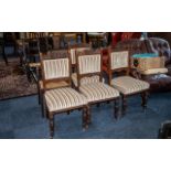 Four Edwardian Upholstered Walnut Dining Chairs, padded back and seat,