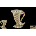 Clarice Cliff Vase, cornucopia shaped, in cream with handle and floral decoration,