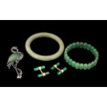Collection of Jade Jewellery comprising a jade faceted bracelet and brooch; a bangle;