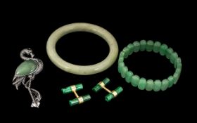 Collection of Jade Jewellery comprising a jade faceted bracelet and brooch; a bangle;