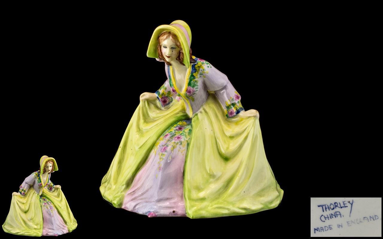 Thorley China Figure of an Elegant Lady in a lime green dress; stamped Made in England; c1930s, 6