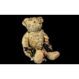 Vintage Teddy Bear, jointed limbs, straw filled, glass eyes, measures approx 26" in length,