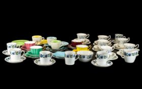 Royal Stuart Harlequin Tea Set, comprising four cups, saucers and side plates in yellow, pink,